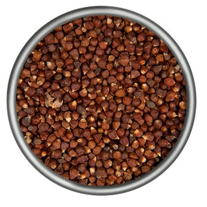 May include: A close-up view of a bowl filled with small, brown, dried grains of allspice.