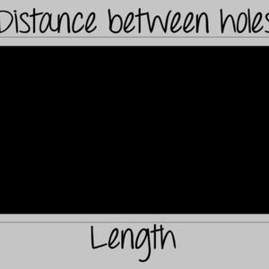 May include: A black rectangular sign with two holes for hanging. The sign has the words "Distance between holes" written at the top and "Length" written at the bottom.