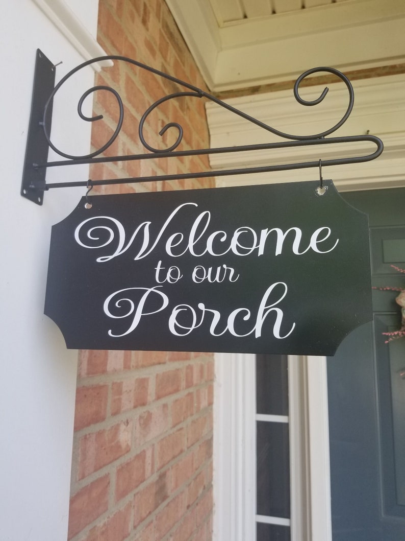 This is a custom metal hanging sign with a hanging rod and hanging hardware which are included. The sign is black with white writing. The writing is able to be perosnalized by you choosing your font and font color.