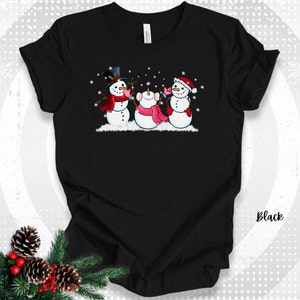 Christmas Snowman T-shirt Friendly Snowmen with Falling Snowflakes Tee Winter Seasonal Apparel Gift for Snowman lovers Snowmen Graphic Tee