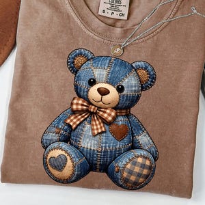 May include: A white ceramic mug with a black handle and the text "But First, Coffee" in a handwritten style. The mug is on a white surface. The mug is approximately 4 inches tall.