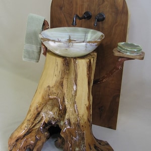 Chestnut oak pedestal sink with green onyx vessel