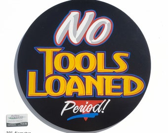 NO TOOLS LOANED Mechanic's shop sign.