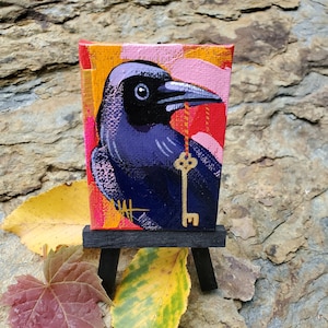 Raven with Key Ornament. For the Bird Lover on your list, a one-of-a-kind painting of this magnificent bird by Ashley Wolff