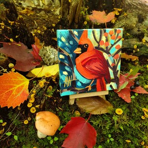 A Cardinal Bird male. For the Bird Lover on your list, a one-of-a-kind painting of this magnificent bird by Ashley Wolff