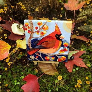 A Cardinal Bird male. For the Bird Lover on your list, a one-of-a-kind painting of this magnificent bird by Ashley Wolff