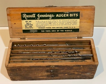 May include: A wooden box containing a set of Stanley Russell Jennings No. 100 auger bits. The box is labeled "The Tool Box of the World".