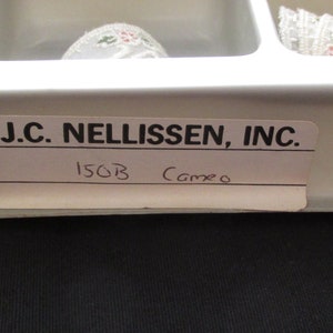 May include: A white label with black text that reads "J.C. NELLISSEN, INC." and "150B Cameo".