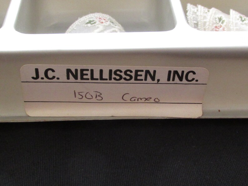 May include: A white label with black text that reads "J.C. NELLISSEN, INC." and "150B Cameo".