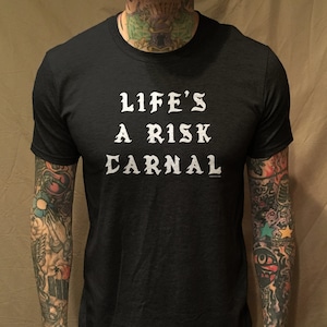 Life&#39;s A Risk text on Black Tee