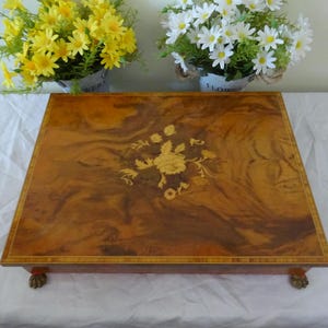 A vintage Italian Sorrento jewellery box  with internal music box.43 x 37 cm