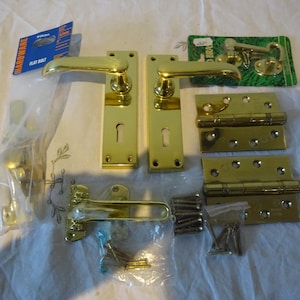 Set of solid brass door ironmongery including door plates heavy brass hinges dead bolt & security latch etc including brass fixing screws
