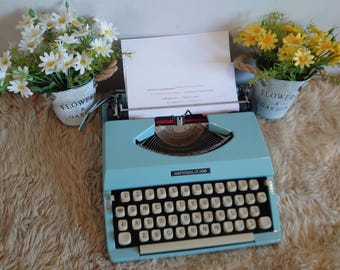 Vintage Imperial 200 portable typewriter in A1  condition in full  working condition including case & Instructions