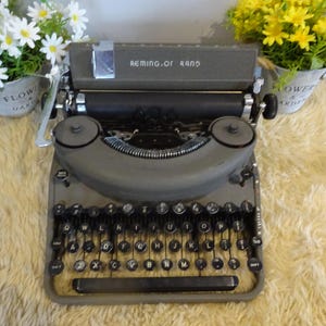 Vintage Remington Rand portable typewriter in great condition need of small repair to one spring or just for spares