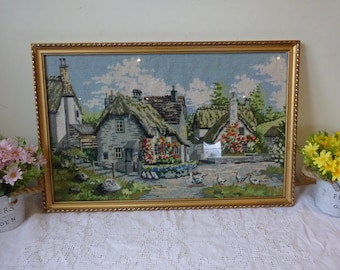 Handmade tapestry of English thatched cottages in a gold leaf covered picture frame 61 x 40 cm wool tapestry glass frame