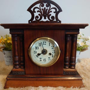 Early 20th century mantle clock oak / mahogany full working order striking on a coiled rod on the hour & half hour  34 x 28 x 16cm
