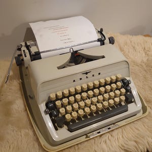 May include: A distressed wooden sign with the words "Welcome to our home" in white. The sign has a rustic finish, ideal for a front porch or hallway, creating a welcoming atmosphere.