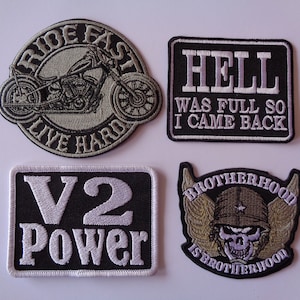 May include: Four embroidered patches with biker and military themes. One patch features a motorcycle and the text "RIDE FAST LIVE HARD." Another says "HELL WAS FULL SO I CAME BACK." A third reads "V2 POWER," and the last shows a skull with wings and the text "BROTHERHOOD IS BROTHERHOOD."