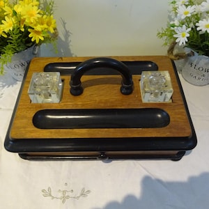 Vintage oak desk top  stationary box , the ebonised handle flanked by glass inkwells above a drawer 33 x 21 x 9 cm