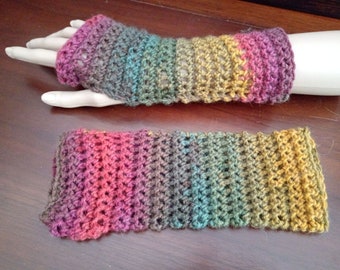 Wrist warmers, fingerless gloves, mitts. Green, yellow purple.