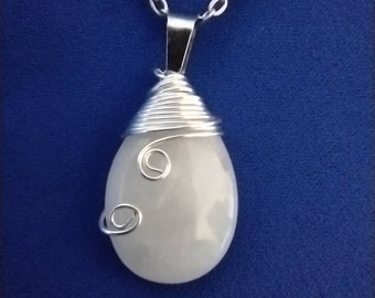 Wire wrapped white quartz gemstone pendant. Purify negative energy.