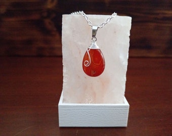 Deep red Carnelian agate wire wrapped Crystal pendant.