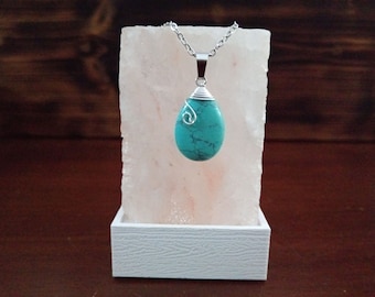 Turquoise pendant wrapped in a silver plated wire. Love. Friendship. Protection.