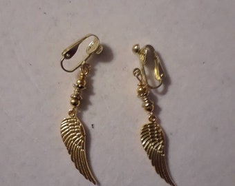 Gold feather clip on earrings