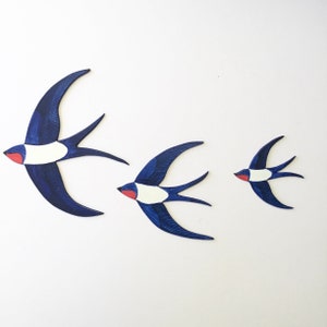 3 flying wooden swallows wall decor