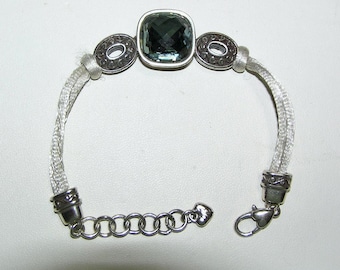 Pulsera vintage BRIGHTON de los años 80 con cabujones facetados azul grisáceos y cordón de seda gris