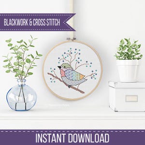 May include: A cross-stitch embroidery of a colourful bird perched on a branch, set within a wooden hoop. The bird features a patterned design with shades of blue, green, orange, and pink. The text "BLACKWORK & CROSS STITCH" and "INSTANT DOWNLOAD" are displayed.