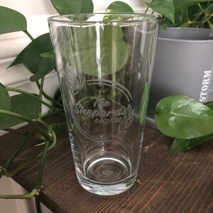 May include: A clear glass pint glass with an etched design that says "The Shepards 06/21/20".