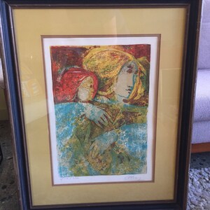 May include: A framed print of a colorful abstract painting depicting two figures with their arms around each other. The figures are partially obscured by a blue and green background. The print is signed "Allan" in the bottom right corner and "Proof 3/300" in the bottom left corner.