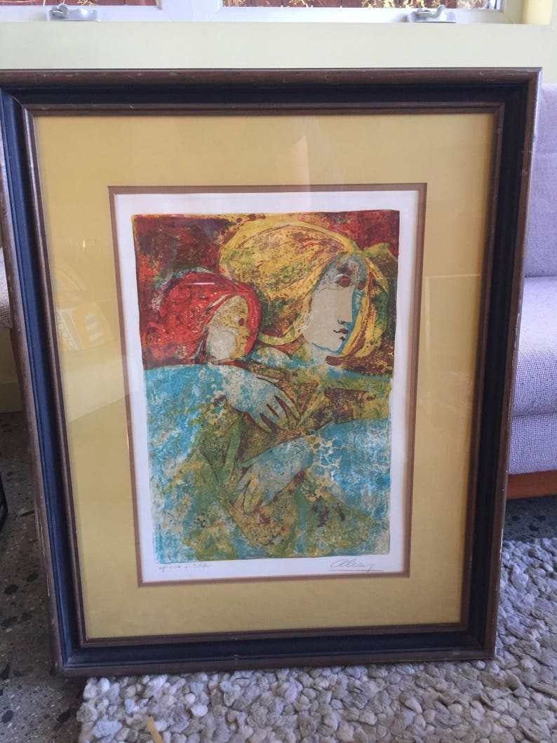 May include: A framed print of a colorful abstract painting depicting two figures with their arms around each other. The figures are partially obscured by a blue and green background. The print is signed "Allan" in the bottom right corner and "Proof 3/300" in the bottom left corner.