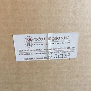 May include: A white label with black text that reads "robert sills gallery, inc. ART AUCTIONS FOR FUND RAISING" and includes two addresses and phone numbers. The label also includes the text "REGISTER NUMBER." followed by the number "A21739".