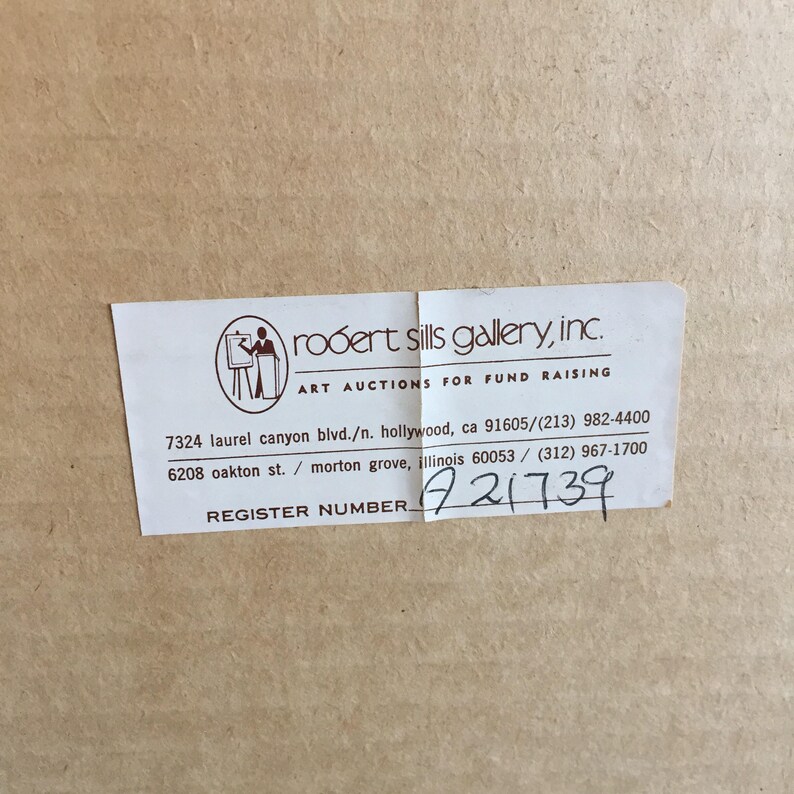 May include: A white label with black text that reads "robert sills gallery, inc. ART AUCTIONS FOR FUND RAISING" and includes two addresses and phone numbers. The label also includes the text "REGISTER NUMBER." followed by the number "A21739".