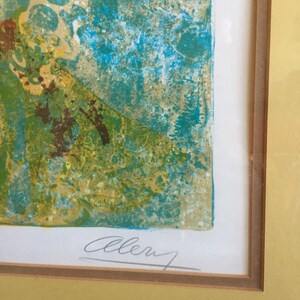 May include: A framed print with a blue, green, and yellow abstract design. The print is signed "Allen" in the bottom right corner.