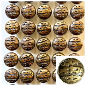 May include: A collection of round, bronze-colored buttons. Each button features a detailed relief design of swimming fish. The buttons are arranged in a grid pattern, with a close-up view of a single button in the lower right corner.