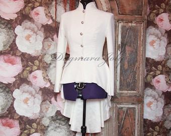 May include: A white high-low jacket with a mandarin collar and silver buttons. The jacket has a fitted bodice and a flowing, asymmetrical hem.