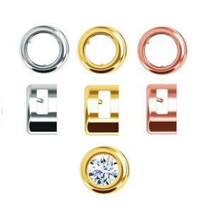 May include: Three bezel settings in silver, gold, and rose gold, each with a small hole in the center. Three matching square settings in silver, gold, and rose gold. One round bezel setting in gold with a clear round gemstone in the center.