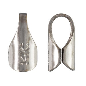 May include: Silver-toned metal pendant bail with a smooth, rounded opening and a flat, rectangular base. The base has a small, engraved design.
