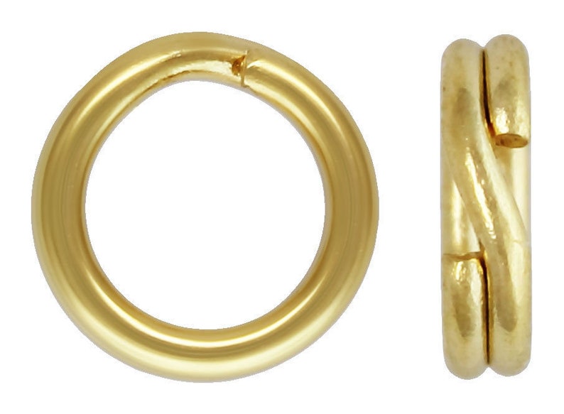 May include: Two gold-colored jump rings, one is a simple round ring, the other is a twisted ring.