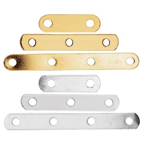 May include: Six metal strap connectors, three gold and three silver, with four holes each. The connectors are arranged in a pyramid shape.