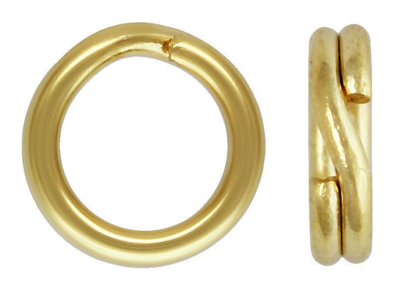 May include: Two gold-colored metal jump rings. One ring is open and the other is closed.