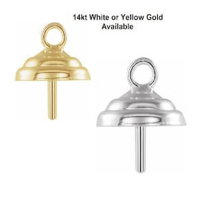 May include: Two 14kt gold pendant bails, one in yellow gold and one in white gold. Both bails have a round loop at the top and a pointed post at the bottom.