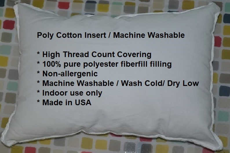 May include: White pillow with a white trim. The pillow has text that reads "Poly Cotton Insert / Machine Washable * High Thread Count Covering * 100% pure polyester fiberfill filling * Non-allergenic * Machine Washable / Wash Cold/ Dry Low * Indoor use only * Made in USA"