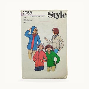 May include: A vintage Style sewing pattern envelope, number 2058, for a girl's size 10 jacket with a 73 cm breast measurement. The cover features illustrations of four different hooded jacket designs in blue, beige, red, and green colours.