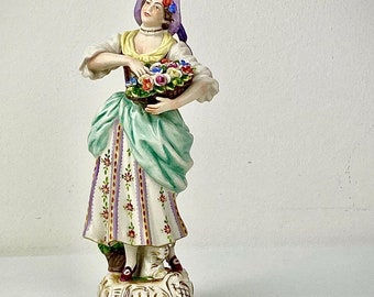German Pretty Figurine of a Flower Seller by Rudoplf Kammer Volkstedt Mid 19th Century