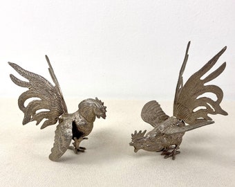 Pair of Fighting Cocks Cockerels Roosters made of a silver coloured metal.