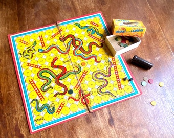 1930s Snakes and Ladders playing board and box with Dice counters and Bakelite shaker Vintage